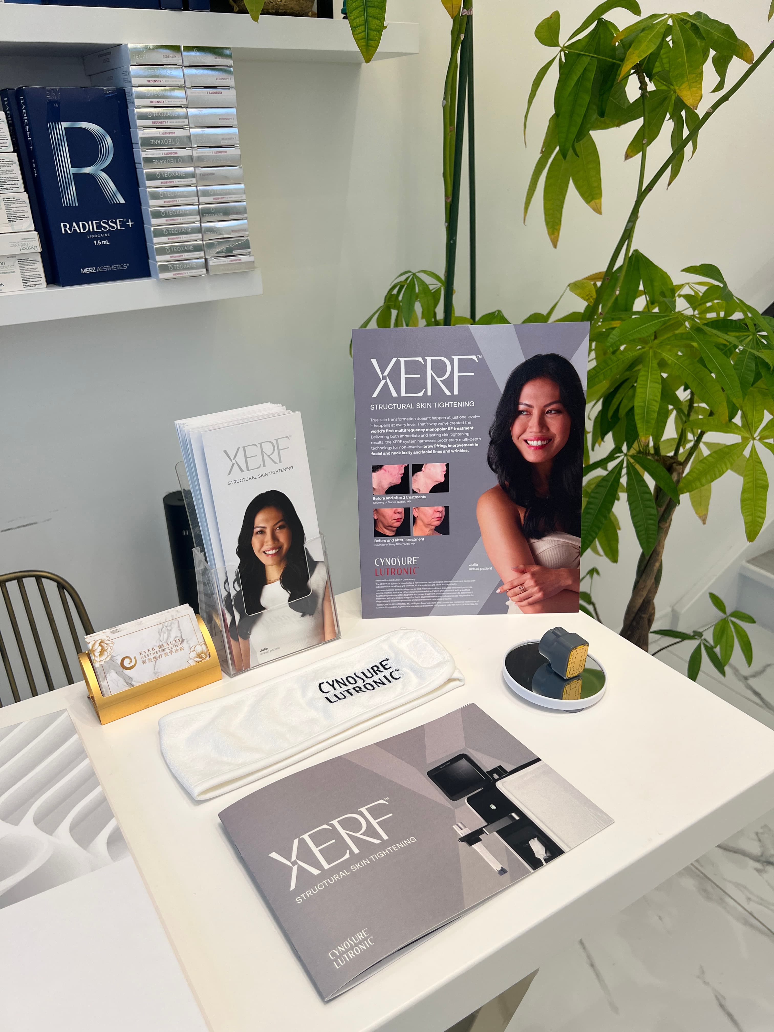 XERF skin tightening brochures, Cynosure Lutronic headband, and cosmetic filler boxes on a table.